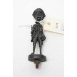 A cast metal figure of a soldier