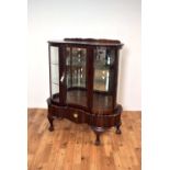 A 20th Century mahogany concave-fronted china display cabinet,