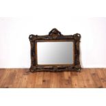 A 20th Century gilt and faux tortoiseshell framed wall mirror of rectangular form