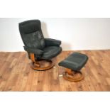 A contemporary Ekornes Stressless leather reclining armchair and matching ottoman footstool
