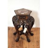 A 20th Century Chinese Oriental carved hardwood jardiniere stand