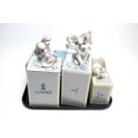 A collection of Lladro ceramic figures of dogs