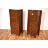 A pair of contemporary hardwood upright chests of drawers