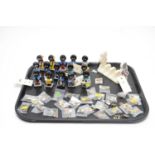 A collection of handpainted Robertson advertising figures; pin badges; and a toast rack
