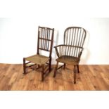 A 20th Century elm comb back windsor chair with another /