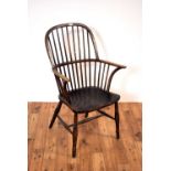 A 19th Century beech and elm comb back Windsor rocking chair