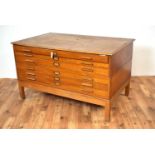 A vintage 20th Century light oak plan chest of cuboid form