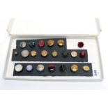 A collection of antique dress studs, including gem-set, carved hardstone and others