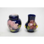 A Moorcroft ‘Magnolia’ ginger jar and cover; together with a Moorcroft vase
