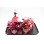 A collection of Victorian and later cranberry glassware