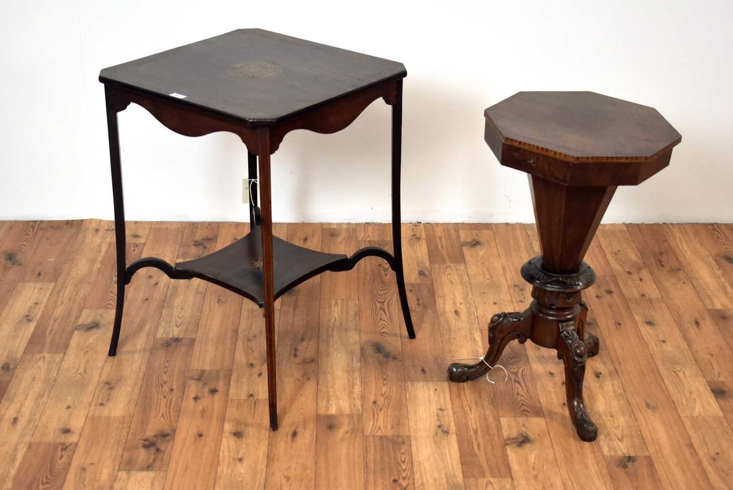 An early 20th Century inlaid mahogany occasional table; and a Victorian work table. /