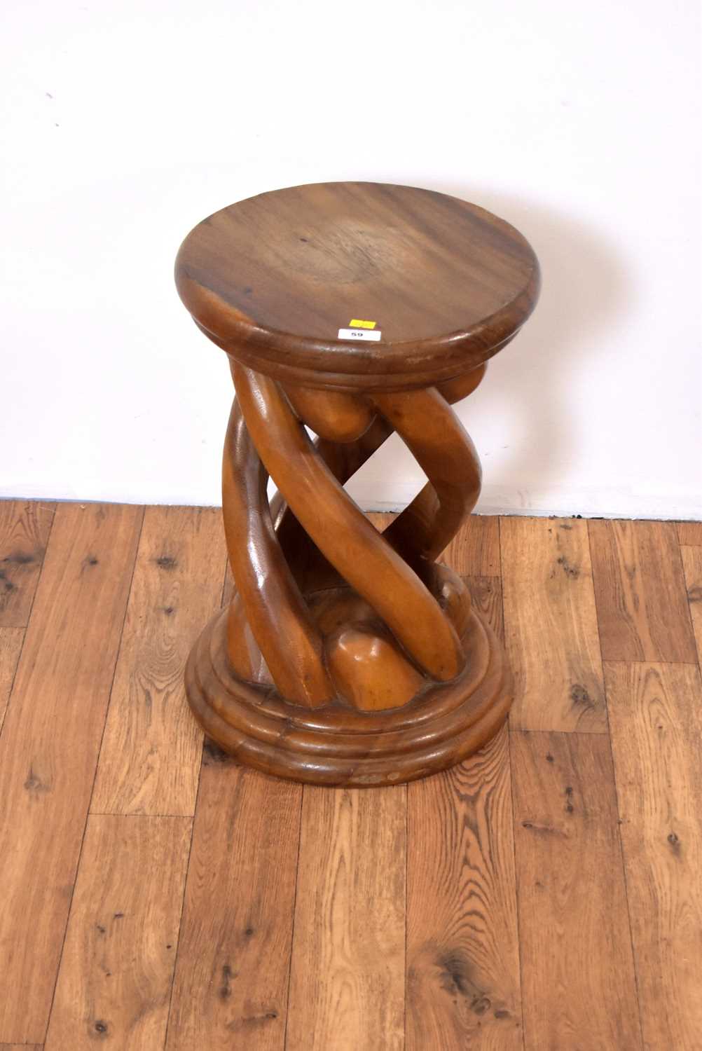 A retro vintage 20th Century carved hardwood stool