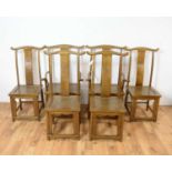 A 20th Century Chinese elm extending dining table and chairs
