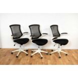 A set of three Modern Luna mesh swivel office chairs by Eliza Tinsley