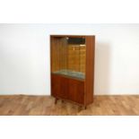 Herbert Gibbs: a retro vintage mid 20th Century teak mirror-backed glazed cabinet