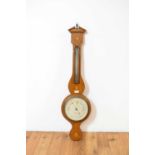 A late Victorian oak framed aneroid barometer