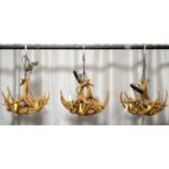 A collection of three 20th Century faux antler chandeliers