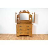 An Edwardian burr walnut dressing chest