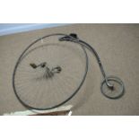 An early 20th Century penny Farthing front wheel and saddle