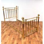 A 20th Century single brass bed