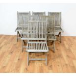 A set of six folding teak garden chairs by Triniti