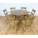 An oak extending dining table and chairs