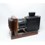 An early 20th Century ebonised metal and mahogany bellows Magic Lantern
