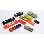 Eleven assorted harmonicas