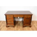 A 20th Century hardwood writing desk