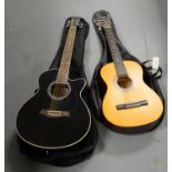 An Encore acoustic guitar; and a Deacon guitar