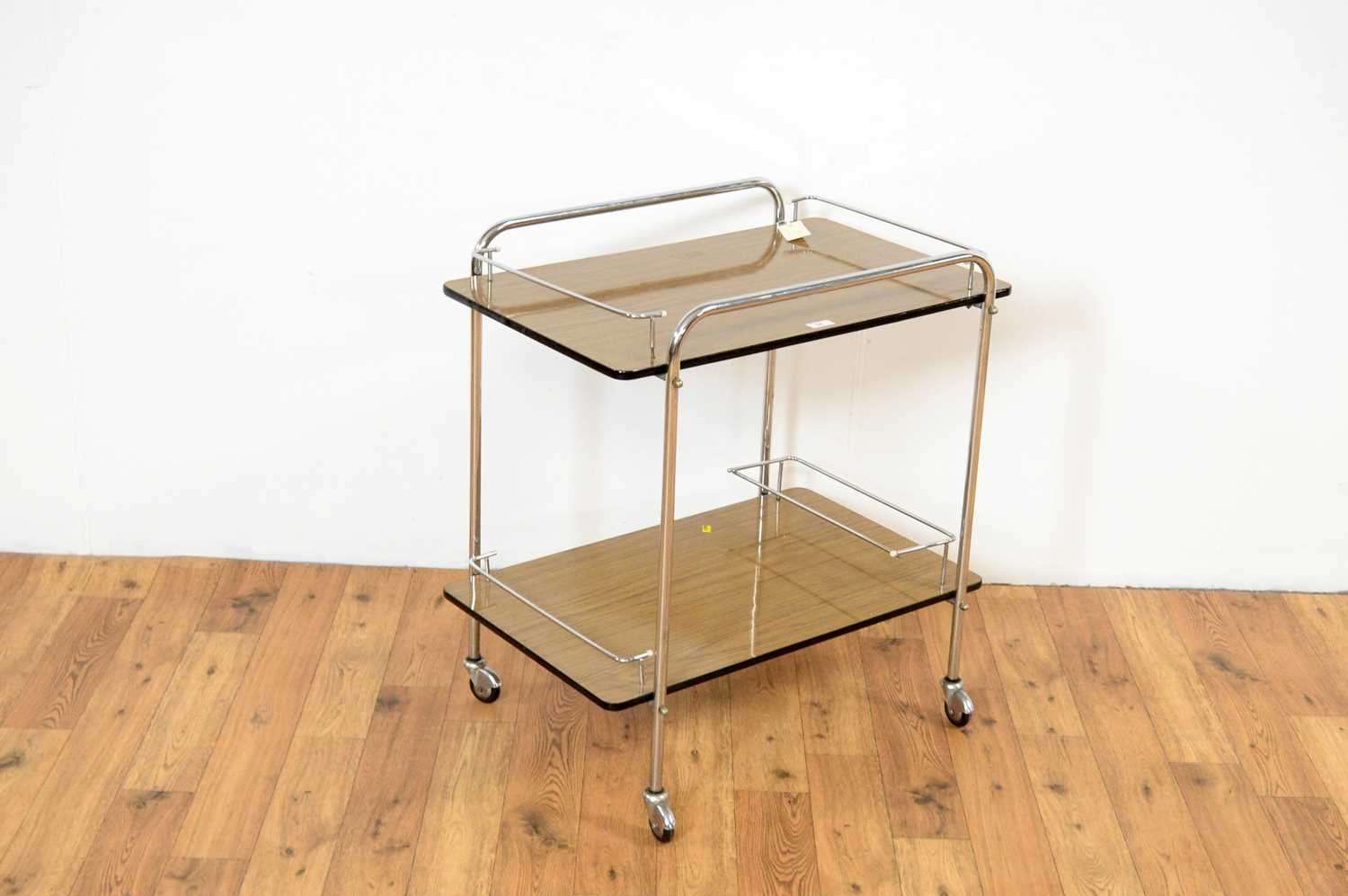 A retro vintage industrial mid 20th Century two tier drinks trolley