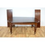 A Victorian mahogany extending dining table