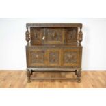 A mid 20th century Jacobean Revival carved oak buffet