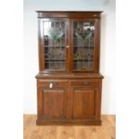 An early 20th Century Arts & Crafts style glazed bookcase