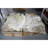 A collection of table linens and lace ware