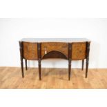 A Regency serpentine fronted mahogany and line inlaid sideboard