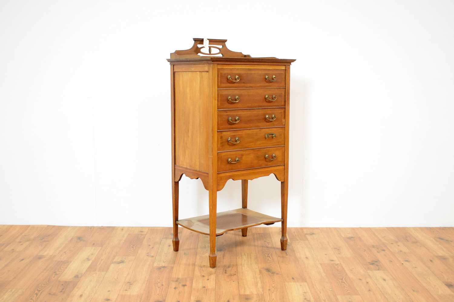 An early 20th Century mahogany music cabinet,