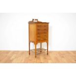 An early 20th Century mahogany music cabinet,