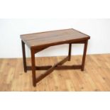 A 20th Century mahogany side table of rectangular form with raised edge