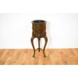 A decorative 20th Century copper lined mahogany jardinière planter in the French taste.