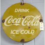 A Coca Cola enamel advertising sign