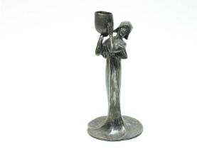 An Art Nouveau bronzed spelter figural candlestick