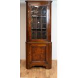 A 20th Century glazed mahogany corner cabinet