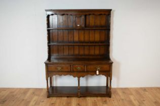 A Titchmarsh and Goodwin Jacobean revival oak dresser