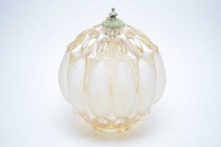 A vintage iridescent and opaque glass light shade