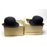 A gentleman’s black bowler hat, and another