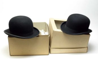 A gentleman’s black bowler hat, and another