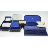 A collection of Victorian and later cases for silver or silver plated wares