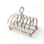 A Victorian silver seven-bar toast rack, by William Hutton & Sons