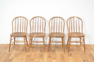 A set of four beech and elm spindle-backed dining chairs